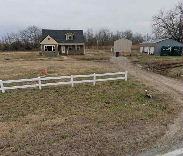 Incredible Real Estate Opportunity: 4-Bedroom Home with Acreage and Detached Garage in Augusta, Kansas